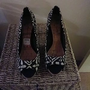 Christian Siriano Aztecs shoes.